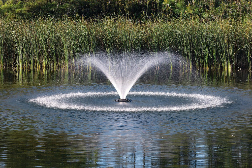 Kasco VFX aerating pond fountain producing a V-shaped water spray to promote surface aeration and circulation.